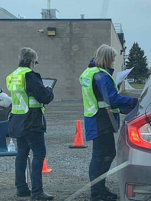 Staff at Arnprior drive through vaccine clinic processing a patient